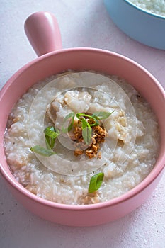 Ox tripe congee or also known as goto in colorful bowls