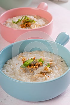 Ox tripe congee or also known as goto in colorful bowls