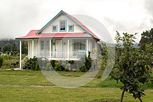 Wooden house in pastel colours  in Oxapampa city photo