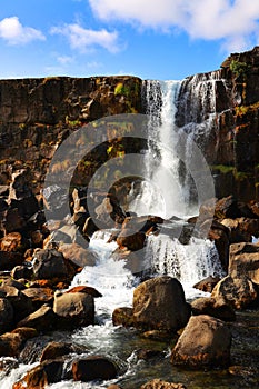 Oxararfoss - the waterfall of Oxara river. Late summer landscape in Thingvellir National Park.