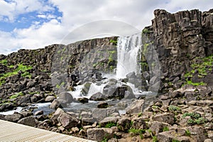 Oxararfoss waterfall in Thingvellir national park, Iceland at sunny weather