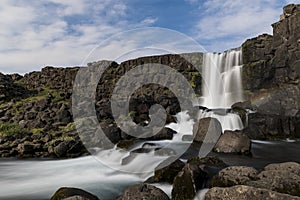 Oxararfoss waterfall in Thingvellir National park in Iceland wit