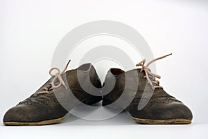 Oxford shoes with gray shoelaces on a flat heel. Gray women`s shoes in a fastening, unwitting.