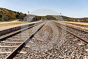 Oxidized railway tracks next to the abandoned Rio Tajo train station, near Garrovillas de Alconetar