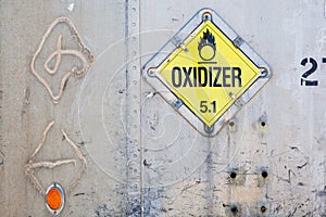 Oxidizer placard on decayed metal container
