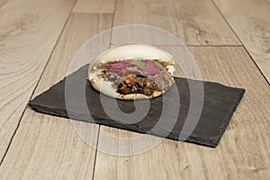 Oxtail bao with confit red onion