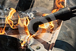 Oxy-Fuel Cutting Torch to cutting car for metal recycling.