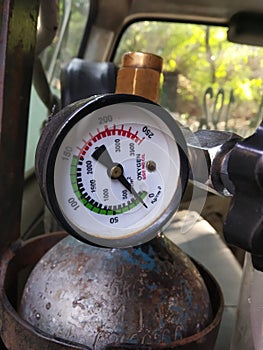 oxygen cylinder with measuring meter.