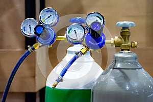 Oxygen cylinder and regulator gauge in factory, equipment photo