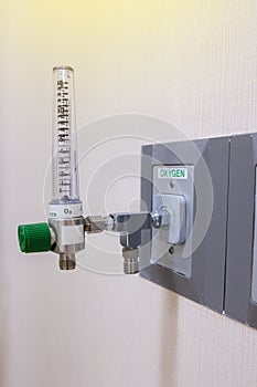 Oxygen flow meter with adapter for pipe on the background