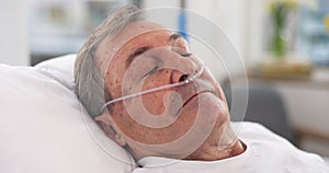Oxygen, hospital bed and senior man sleeping with ventilation and breathing tube support in a clinic. Elderly patient
