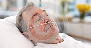 Oxygen, hospital bed and senior man sleeping with ventilation and breathing tube support in a clinic. Elderly patient