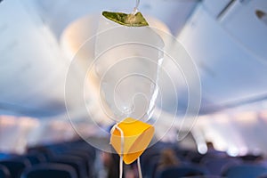 oxygen mask drop from the ceiling compartment on airplane