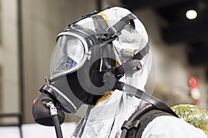 Oxygen mask in white chemical preventive suit