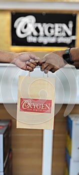 OXYGEN  Paper  bag  hand overing