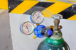 The Oxygen valve and pressure gage on tank.