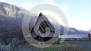 Oye stave church on Vangsmjosse lake in Norway in Autumn