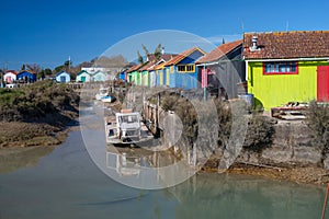 Oyster fishermen huts and boats in harbour at Oleron Island on Atlantic coast of France