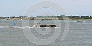 Oyster transport boat in Marennes d`oleron charente France in web banner header