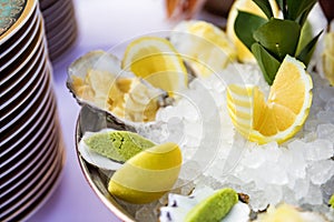 Oysters with lemons served on the restaurant table