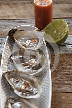 Oysters with lime and hot sauce