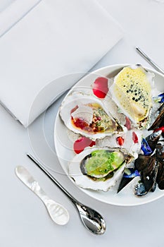 Oysters poached and served with lemon foam and caviar. The other smoked and served with ponzu granite.