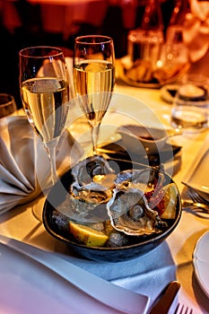 Oysters and wine. Romantic dinner table for two, restaurante.