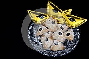 Ozney haman pastry and masquerade mask symbols of the Jewish holiday of Purim