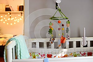 Ð¡ozy baby bed in the bedroom. Cosy white crib.