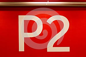 P2 huge sign painted on red wall photo