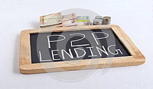 P2P Lending Concept Highlighted Through Handwritten text on Chalkboard