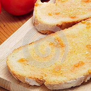 Pa amb tomaquet, bread with tomato, typical of Catalonia, Spain photo