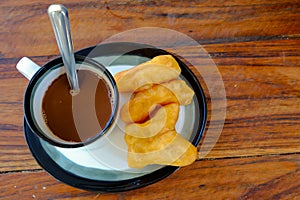 Pa-tong-ko in Thai word with old thai style hot coffee in glass