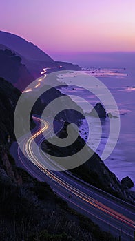 Pacific Coast Highway California with motion lights sunset over the ocean