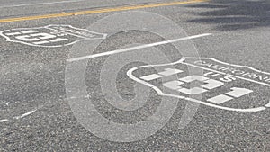 Pacific Coast Highway road marking on asphalt, historic route 101 sign in California, trip in USA.