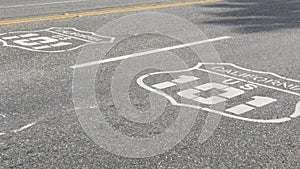 Pacific Coast Highway road marking on asphalt, historic route 101 sign in California, trip in USA.