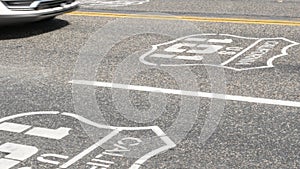 Pacific Coast Highway road marking on asphalt, historic route 101 sign in California, trip in USA.