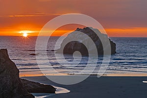 Pacific Ocean sunset view of Face Rock in Bandon Oregon in panoramic format.