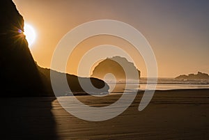 Pacific Ocean sunset view of Face Rock in Bandon Oregon in panoramic format.