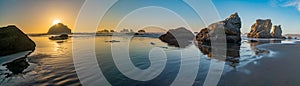 Face Rock in the pacific Ocean at sunset in panoramic format.
