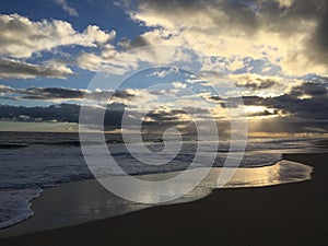 Pacific Ocean Waves at Beach in Kekaha during Sunset on Kauai Island, Hawaii.