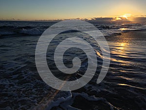 Pacific Ocean Waves at Beach in Kekaha during Sunset on Kauai Island, Hawaii.