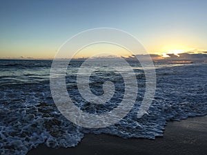 Pacific Ocean Waves at Beach in Kekaha during Sunset on Kauai Island, Hawaii.