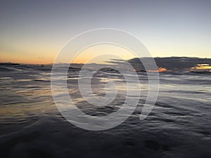 Pacific Ocean Waves at Beach in Kekaha during Sunset on Kauai Island, Hawaii.