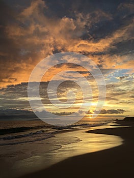 Pacific Ocean Waves at Beach in Kekaha during Sunset on Kauai Island in Hawaii.