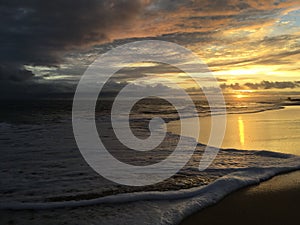 Pacific Ocean Waves at Beach in Kekaha during Sunset on Kauai Island in Hawaii.