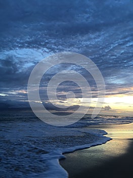 Pacific Ocean Waves at Beach in Kekaha during Sunset on Kauai Island in Hawaii.