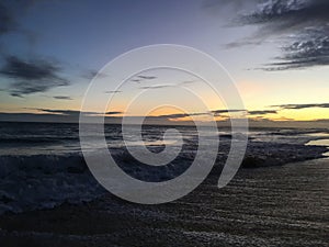 Pacific Ocean Waves at Beach in Kekaha during Sunset on Kauai Island, Hawaii.