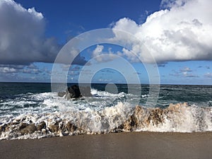 Pacific Ocean Waves and Clouds at Lumahai Beach at Kauai Island, Hawaii.