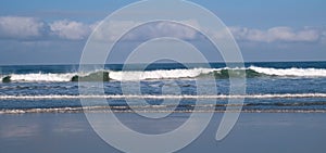 Pacific ocean waves crashing along the beach